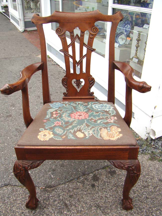 A very fine 18th century Chippendale 'style' walnut armchair with dog head arms